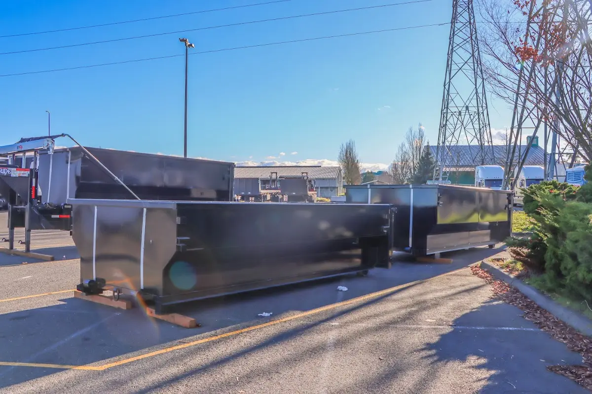 Roll-off dumpster ready for waste disposal at job site for Construction Dumpster Rental in East Rockaway